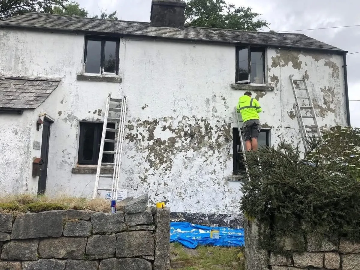 Cottage with blown, flaking render before repair in St Austell